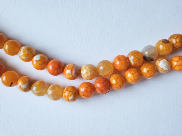 Fil de perles en Agate de feu (Safran) orange - 10mm