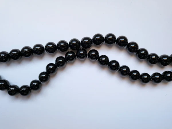 Fil de perles en Onyx noir - 12mm