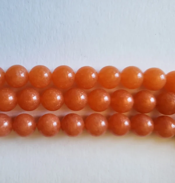 Fil de perles en Jade papaye orange - 8mm